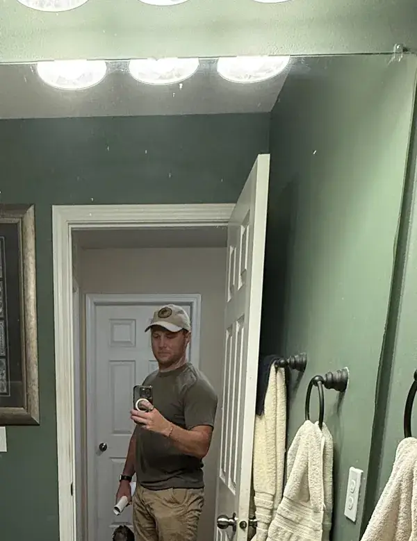 Drew Heberer On A Walk-Through Of A House In Southeast Ankeny, Seen In The Bathroom Mirror